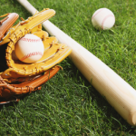 a photo of a baseball bat, a baseball, and some mitts, representing the LA Dodger's recent win
